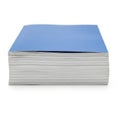 A stack of light blue paper notebooks or journals isolated on white background Royalty Free Stock Photo