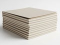 Stack of light-colored corrugated cardboard sheets on a white background Royalty Free Stock Photo