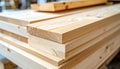 Stack of lightcolored wooden planks with visible grain in a workshop Royalty Free Stock Photo