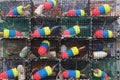 Stack of lobster traps with colorful buoys Royalty Free Stock Photo