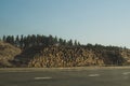 Stack of logs lying on the side of the road. big pile of timber