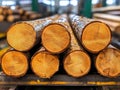 A stack of logs sitting on top of a table in a warehouse Royalty Free Stock Photo
