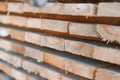 Stack of lumber of a wooden board from a tree, close-up, background. Wooden boards at the sawmill, carpentry workshop Royalty Free Stock Photo