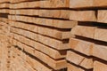 Stack of lumber of a wooden board from a tree, close-up, background. Wooden boards at the sawmill, carpentry workshop Royalty Free Stock Photo
