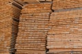 Stack of lumber of a wooden board from a tree, close-up, background. Wooden boards at the sawmill, carpentry workshop Royalty Free Stock Photo