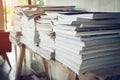 Stack of magazine book on wooden table shelf in living room