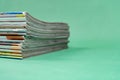 Stack magazines on green background Royalty Free Stock Photo