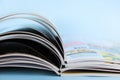 Stack of magazines on light blue background, closeup Royalty Free Stock Photo