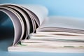 Stack of magazines on light blue background, closeup Royalty Free Stock Photo