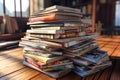 A stack of magazines sitting on top of a wooden table Royalty Free Stock Photo