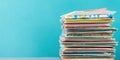 Stack of magazines on table with blue background Royalty Free Stock Photo