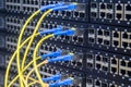 A stack of managed Internet switches is connected by fiber optic cables. Server equipment of the main technical platform. The