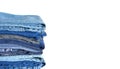 Stack on many jeans isolated on white close-up Royalty Free Stock Photo