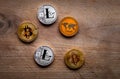 Stack of many shiny crypto coins on daylight in nature on wooden table background. Silver and golden coins of cryptocurrency on
