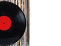 Stack of many vinyl records in old color covers on left side on photo on white background