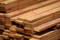 Stack of many wooden planks in construction site