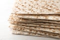 Stack of matzos on white wooden table, closeup Royalty Free Stock Photo