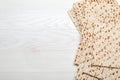 Stack of matzos on white wooden table, flat lay. Space for text Royalty Free Stock Photo