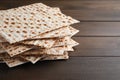 Stack of matzos on wooden table, closeup. Space for text Royalty Free Stock Photo
