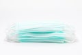 A stack of medical face masks on a white background. Article about the second wave of coronavirus. Protection of the respiratory Royalty Free Stock Photo