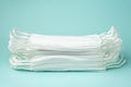 Stack of medical masks on the blue background Royalty Free Stock Photo