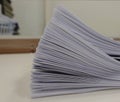 Stack of meeting paper on the table with blurred of office room Royalty Free Stock Photo