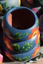 Stack of Mexican ceramic pots, blue and grey painted floral patterns Royalty Free Stock Photo