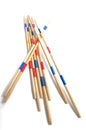 Stack of Mikado game wood sticks on white background. Royalty Free Stock Photo