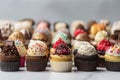 stack of mini cupcakes in assorted flavors and designs Royalty Free Stock Photo