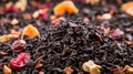 Mix of black tea leaves and dried fruits. AI generated. Royalty Free Stock Photo