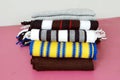 Stack of modern different colors winter woolen scarfs Royalty Free Stock Photo