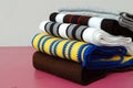 Stack of modern different colors winter woolen scarfs Royalty Free Stock Photo