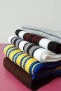 Stack of modern different colors winter woolen scarfs Royalty Free Stock Photo