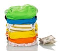 Stack modern eco-friendly diapers and money isolated on white. Royalty Free Stock Photo