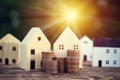 Stack money coins on the wooden table with a simulated wooden house. Royalty Free Stock Photo