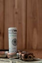 Stack of Money, drugsand a gun on a wooden table, concept about danger and threat of the drug Royalty Free Stock Photo