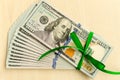 A stack of money with a ribbon. Expensive gift Royalty Free Stock Photo