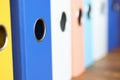 Stack of multi-colored folders is on the table. Royalty Free Stock Photo