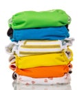 Stack of multi-colored modern eco-friendly diapers is isolated o Royalty Free Stock Photo