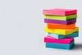 A stack of multi-colored stickers of blocks for notes. Space for text. Royalty Free Stock Photo