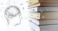 Stack of multicolored books and human man head with brain. Old textbooks stacked on each other. Online education