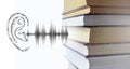 Stack of multicolored books and sound audio wave to human ear. Listen audiobooks online education technology concept