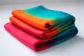 Stack of multicolored fabric towels on white background. Folded rainbow tablecloth or blanket. Generative AI