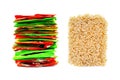 Stack of Multicolored Foil Plastic Bags and Block of Dried Instant Noodles, Ramen Isolated on White Background. Fast Food,