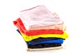A stack of multicolored knitwear, t-shirts, stacked vertically, isolated on a white background Royalty Free Stock Photo