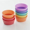 Stack of Multicolored Silicone Cupcake Baking Cups on White Surface Food Photography Royalty Free Stock Photo