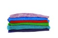 Stack of multicolored winter clothes isolated on white background