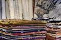 Stack of multicolored quality rugs at carpet shop, Carpets variety selection rolled up rugs shop store Royalty Free Stock Photo