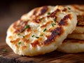 A stack of naan bread on a wooden cutting board Royalty Free Stock Photo
