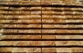 Stack of natural rough wooden boards. Wooden boards, lumber, industrial wood. Royalty Free Stock Photo